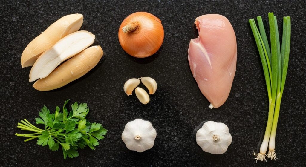 Ingredientes para a receita de coxinha de mandioca com frango organizados em uma bancada.