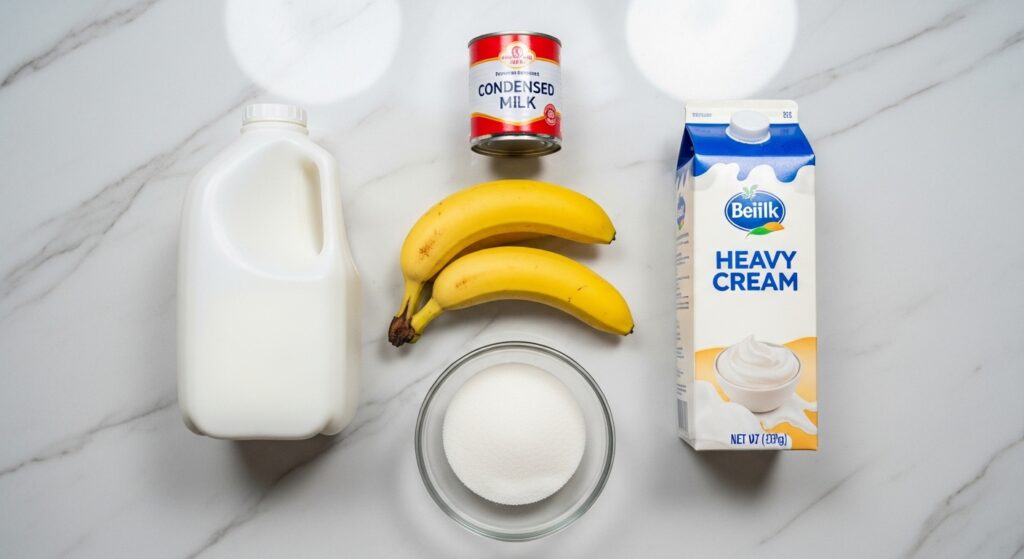 Ingredientes para a receita de banana caramelizada na travessa organizados em uma bancada.